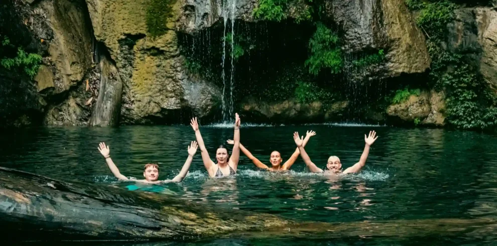 a group of people in the water with their arms up-3-Day Private Tour – 4x4 flipside vietnam hero feat