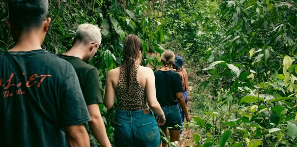 group of travelers walking in forest 4-Day Private Tour – 4x4 flipside vietnam ha giang loop hero feat